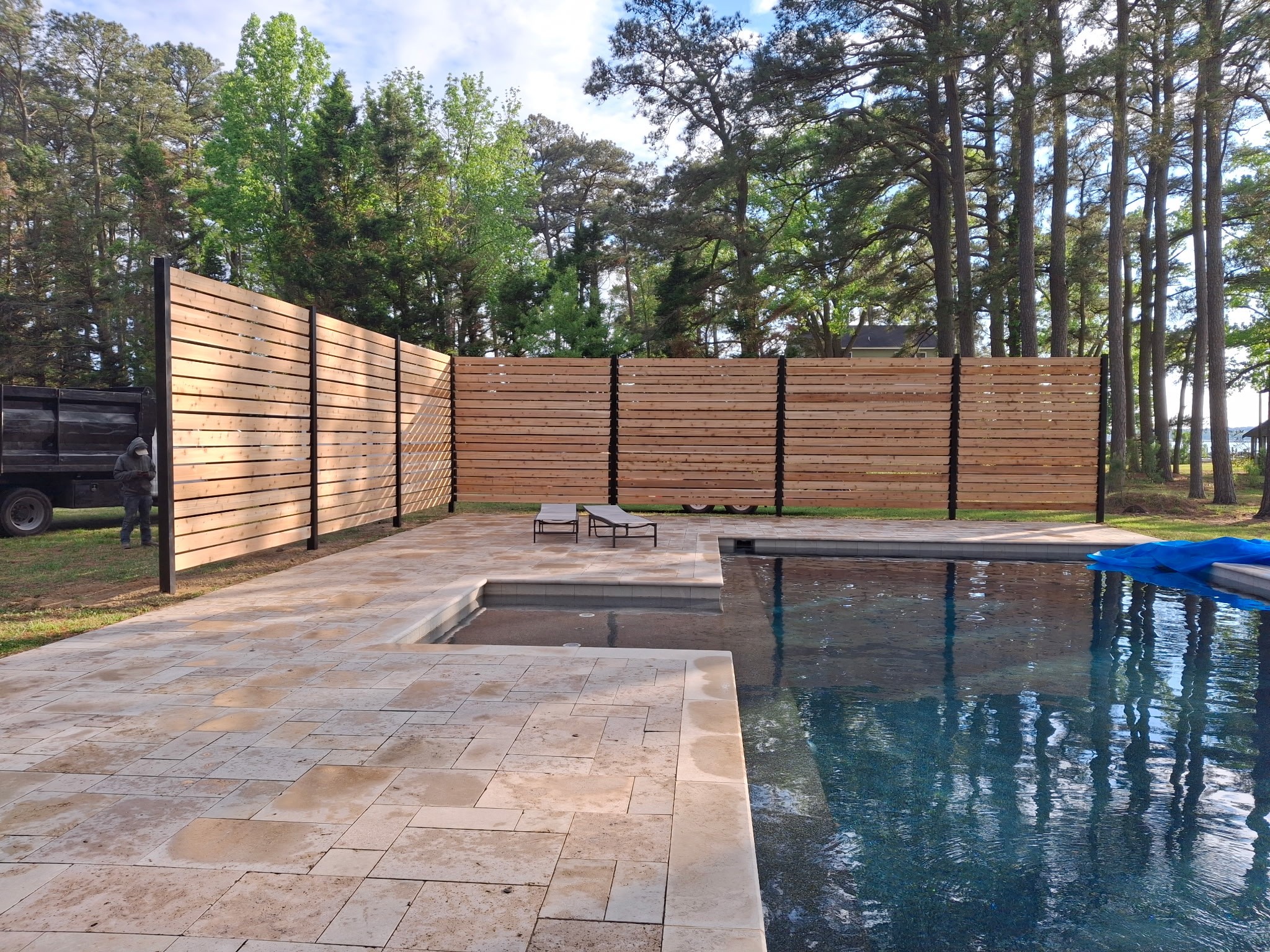 Privacy fence installed around a pool
